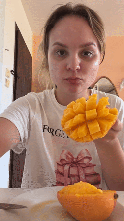Mango breakfast and a sleeping cat in a Tel Aviv home
