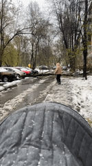 Moscow families brave unexpected spring snowfall with young children