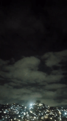 Pre-dawn Caracas cityscape observed from multiple indoor vantage points