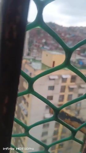 Witness documents Caracas barrios under overcast skies June evening