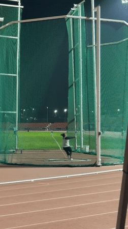 Night hammer throw practice observed in Santiago athletic facility