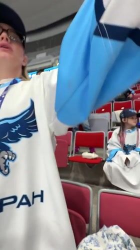 Hockey fans cheer during game in Sirius, Russia