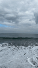 Night surfing session documented under cloudy skies in Indonesia