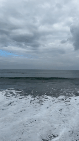 Night surfing session documented under cloudy skies in Indonesia