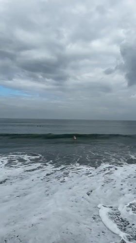 Night surfing session documented under cloudy skies in Indonesia
