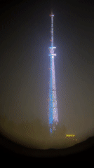 Public telescope captures colorful tower lights through fog in Irkutsk