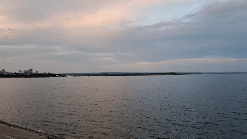 Irkutsk at golden hour: Angara River, city streets, summer dusk