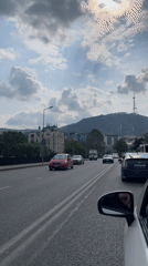 Traffic observed near historic clock tower in Tbilisi