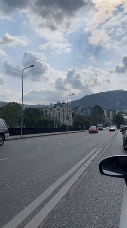Traffic observed near historic clock tower in Tbilisi