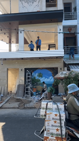 Construction worker paints tropical mural in Nha Trang