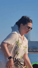 Boat passengers film W Hotel Barcelona from Mediterranean waters