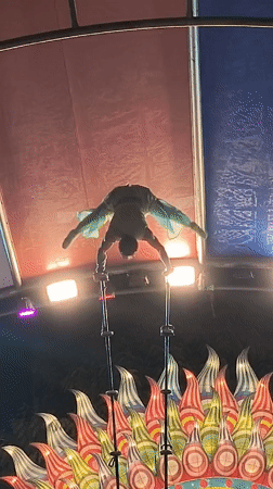 Circus performers showcase acrobatic acts in nighttime Tacna show