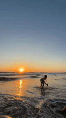 Urban beach sunset draws families and beachgoers during evening hours