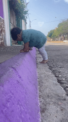 Toddler plays outdoors in Altagracia amid domestic Venezuelan scenes