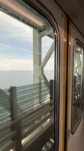 Train passenger films cable bridge view in Izumisano Japan