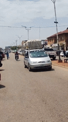 Street scenes show vehicles, children moving goods in residential area