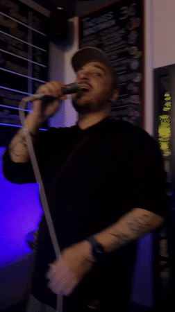 Live music performance at Montenegro bar features singer and bassist