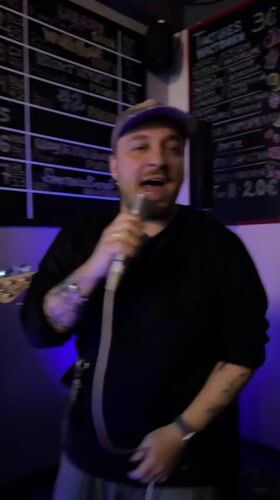 Live music performance at Montenegro bar features singer and bassist