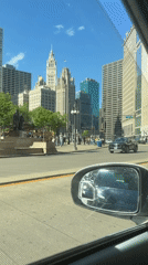 Driver documents routine downtown Chicago traffic and pedestrians