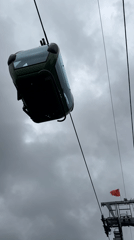 Cable cars operate through overcast Da Lat morning