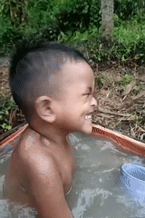 Outdoor bath in a tarp tub, rural Indonesia