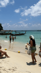 Woman takes beach selfie in Patong, Thailand