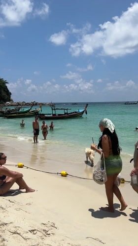 Woman takes beach selfie in Patong, Thailand