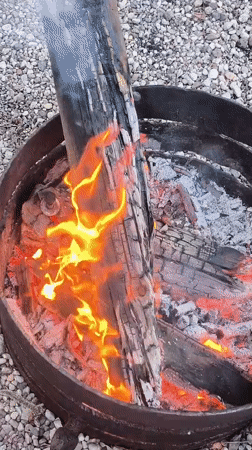 Woman enjoys outdoor fire pit gathering in Lilaste
