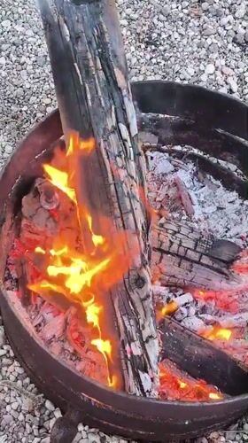 Woman enjoys outdoor fire pit gathering in Lilaste