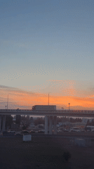 Truck crosses overpass at sunset near Novaya Usman