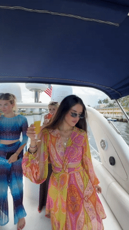Evening boat gathering in Miami marina with city skyline views