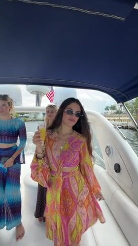 Evening boat gathering in Miami marina with city skyline views