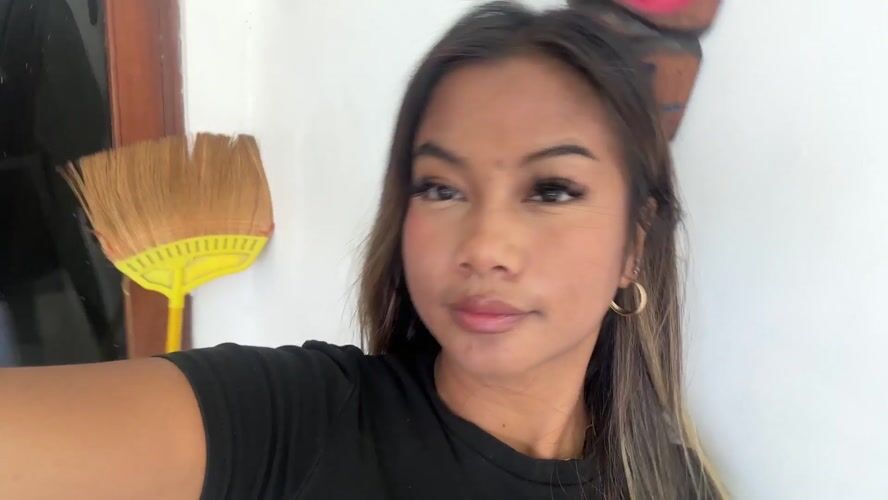Woman records selfie videos indoors in Sukawati, Indonesia