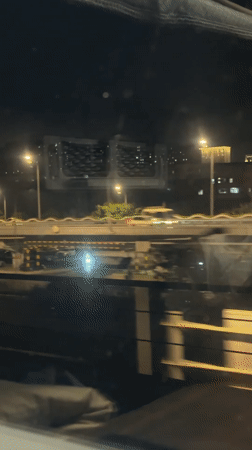 Nighttime traffic scene captured from vehicle in Beijing district