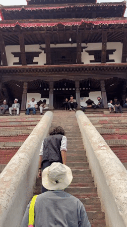 Daily life documented around traditional pagoda architecture in Kathmandu