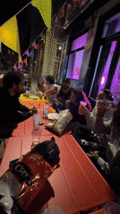 Young adults dine outdoors at Lyon restaurant