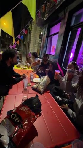 Young adults dine outdoors at Lyon restaurant