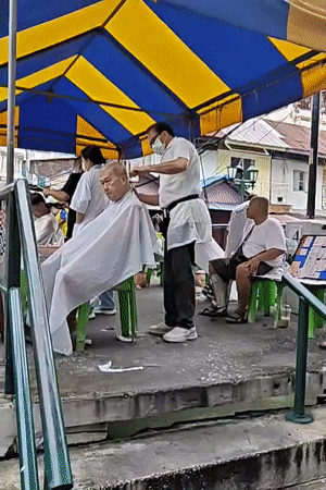 Street shrines, canal edges, and a barbershop in Bangkok