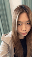 Woman with highlighted hair recorded indoors in Nan'an District