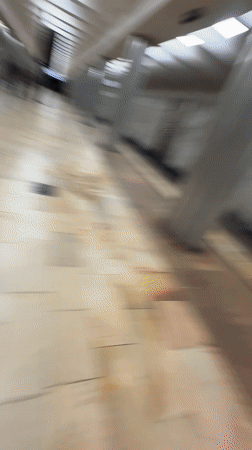 Man in red jacket filmed smiling indoors in Khimki