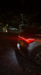 Nighttime car footage captures Christmas lights in Thai village