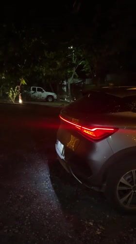 Nighttime car footage captures Christmas lights in Thai village