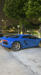 Blue Lamborghini Aventador parked at night in Dongguan