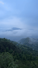 Dense morning mist blankets Pokhara's mountains and cityscape