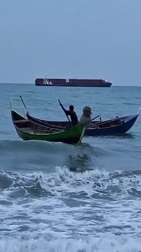 Traditional fishing boats working the waters off Lhokseumawe