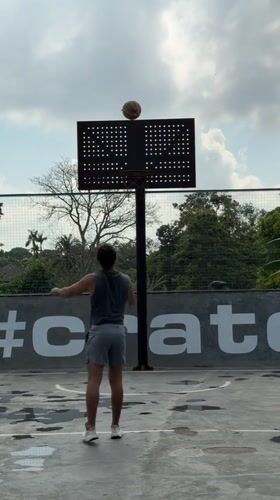 Pickup basketball on a wet Mengwi court with a café stop
