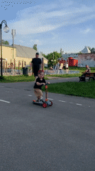 Children play with scooters in Klin park
