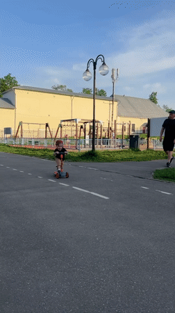 Children play with scooters in Klin park