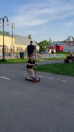 Children play with scooters in Klin park