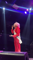 Drag performer takes the stage in Barranco, red gown and crown